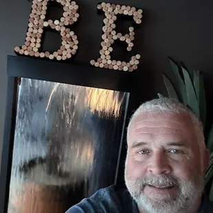 a man sitting in front of a mirror