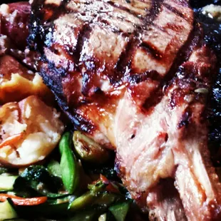 16 oz Ditka Pork Chop stuffed w/succulent pulled pork &amp; roasted pork belly over herbal demi glace served w/smashed roasted red potatoes