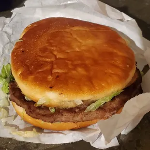 a hamburger with lettuce