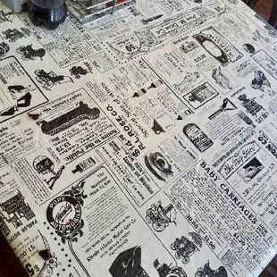 a table covered in a newspaper