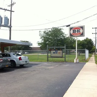 two cars parked in a parking lot