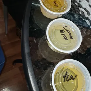 four cups of wine on a table