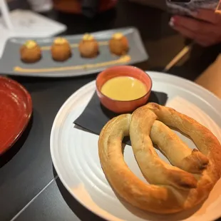 The pretzel and mac n cheese croquettes in the background