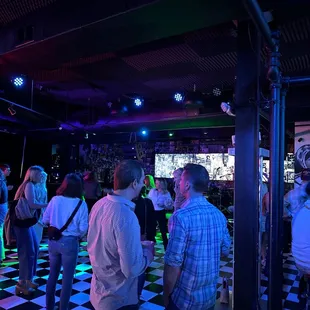 a group of people standing in a room