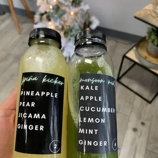a person holding a bottle of juice