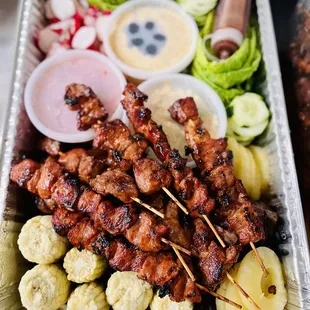 Feast platter with TriTip and chicken underneath