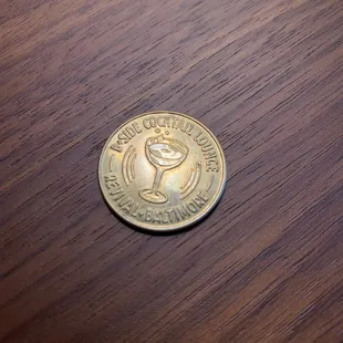 Jukebox coin prompts the bar's hidden door to open