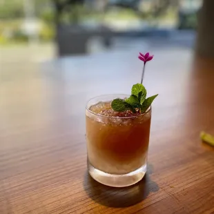 a drink with a flower in it