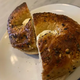 Close up of wood-fired bagel with cream cheese