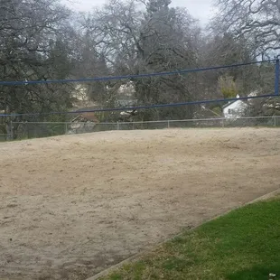 One of 2 volleyball court on top of hill