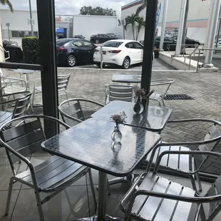 Entrance, walk past some displayed cars of the dealership
