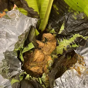 a banana plant wrapped in tin foil