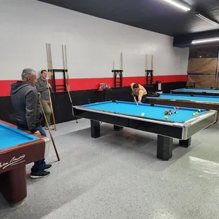 two men playing pool