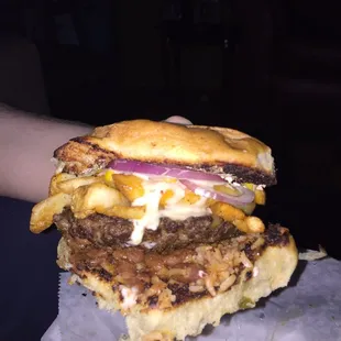 BA burger with ranchero beans, rice, fries, and queso.