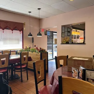 a restaurant with tables and chairs