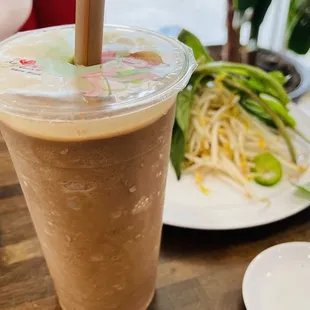 a cold drink and a plate of food