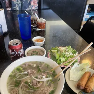 Beef Pho with extra meatballs and fried eggrolls... of course a De. Pepper