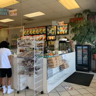 a woman standing in front of the counter