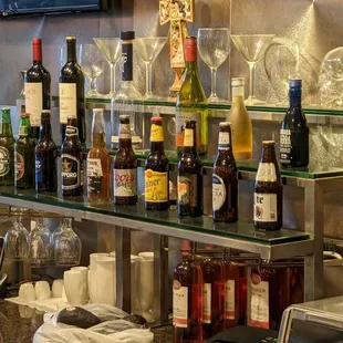 a bar with many bottles of alcohol