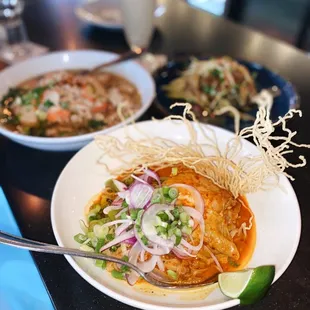 green mango salad, tom yum noodle soup, khao soi gai (ig @fanaticdiner)