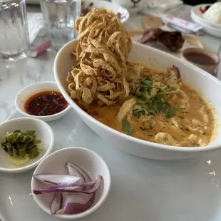 Khao Soi (Northern Style Curry Noddle soup with chicken and Egg Noddle)