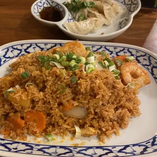 Pineapple fried rice, and pot stickers