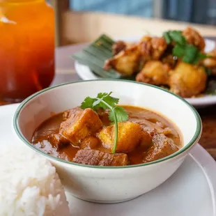 Mussamun Curry - Braised Beef, potatoes, nuts, and coconut milk in Massamun Curry