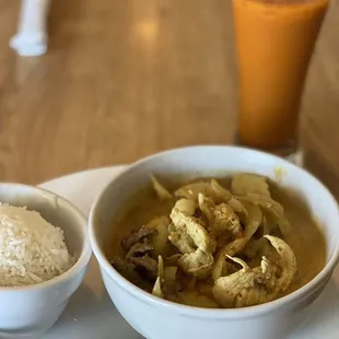 a bowl of soup and a bowl of rice