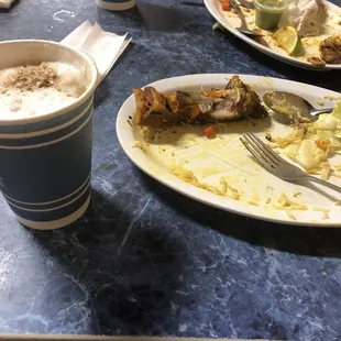 Delicious milky coffee and completely eaten food.