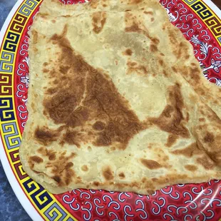 I think this was called Jooti, a bread used to eat the meal instead of utensils.  A flatbread, not like the injera.  1/28/15