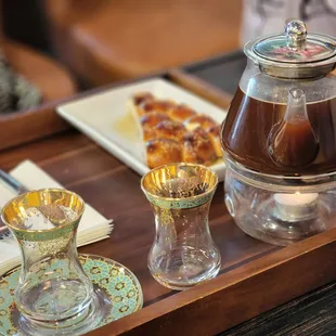 a tray of food and a coffee pot