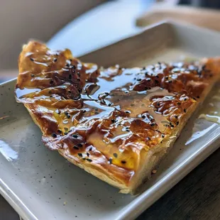 a slice of pizza on a plate