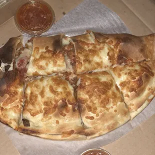 Large chicken parm calzone. Cheese is awesome!