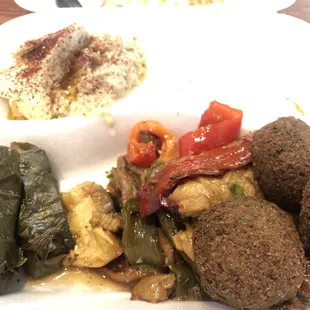 Baba Ghannouj Veggie Platter 3 falafel, 2 grape leaves, choice of salad, baba ghannouj, hummus &amp; cucumber sauce.