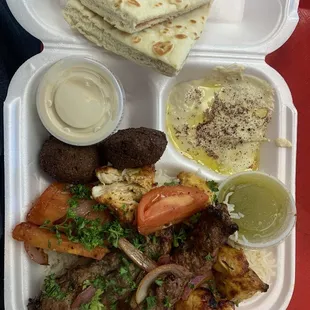 Chicken and kafta kabobs, rice, falafel, pita and humus.