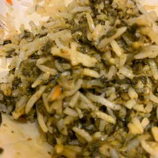 a plate of rice and greens