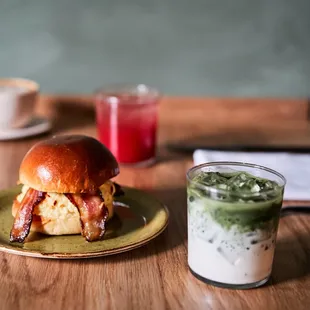 a sandwich and a drink on a table