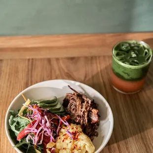 a bowl of food on a wooden table