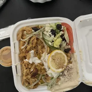 Chicken shawarma, comes with rice, hummus and a salad
