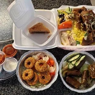 Lamb gyro plate, stuffed grape leaves, falafel and baklava.