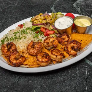 a plate of food with shrimp and rice