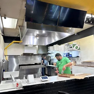 a man preparing food in a kitchen