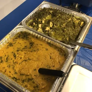 three pans of food on a table