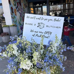 a sign in front of a building