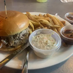 Pulled pork sandwich, fries, slaw and Carolina style barbecue sauce