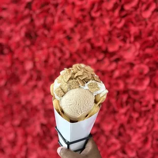 Cinnamon Toast Crunch bubble waffle With the backdrop in the back for ALL THE PHOTOS YOU WANT