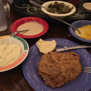 Chicken fried steak and sides.