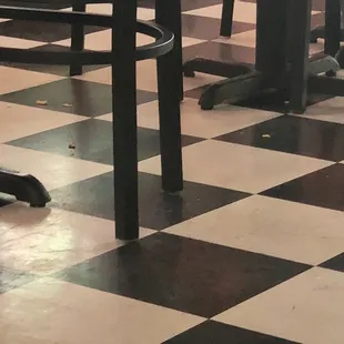 Discarded food all over the floor. The floor needs buffed. The floor was disgusting looking.