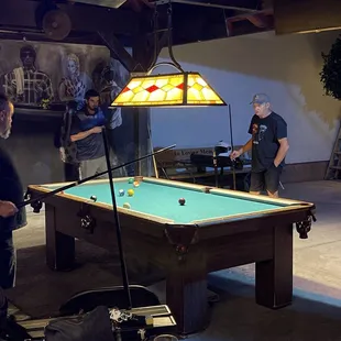 outdoor pavilion with pool tables