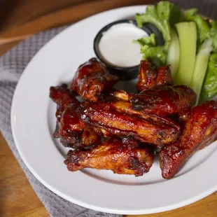 a plate of wings and a side of celery